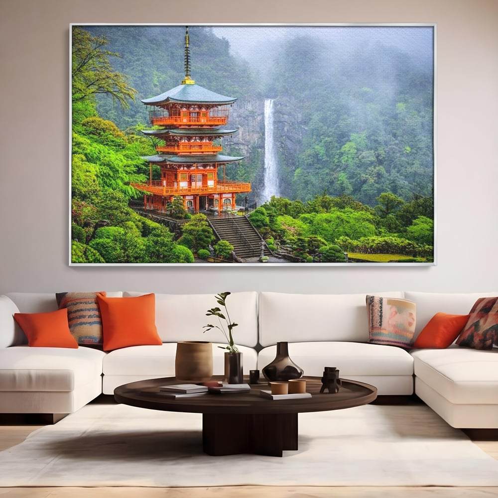 Tablou canvas cu tablou canvas cu pagoda si cascada, in rama de aluminiu argintiu, pe perete intr-un living